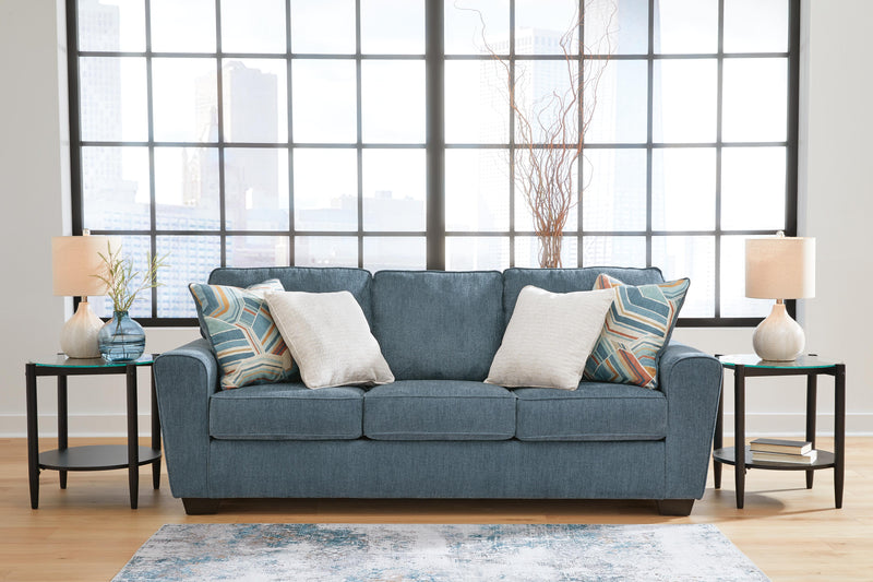 Ashley Furniture Cashton sofa featuring plush cushions and neutral fabric upholstery, shown in a modern living room setting.
