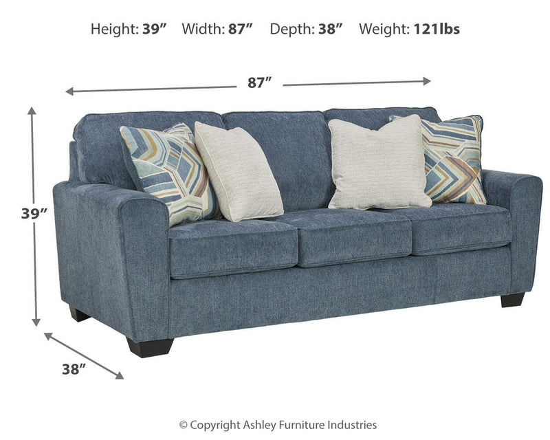 Ashley Furniture Cashton Sofa in neutral fabric with plush cushions and rolled arms, perfect for living room comfort.