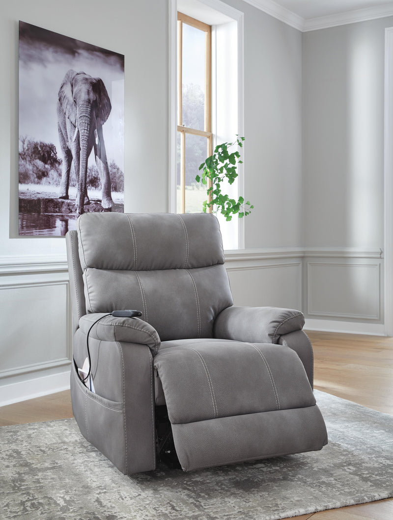 Ashley Furniture Next-Gen Durapella Power Lift Recliner shown from an angle, featuring plush upholstery and a reclining, lifting mechanism.
