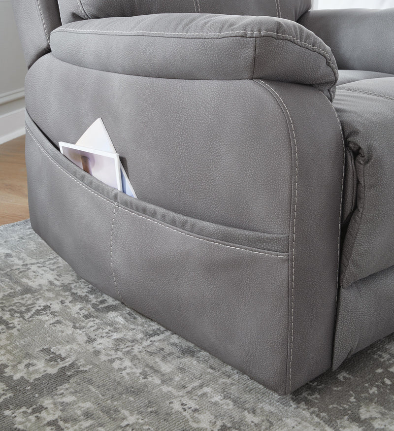 Ashley Furniture Next-Gen Durapella Power Lift Recliner with pocket on side, plush cushioning, and adjustable reclining features.