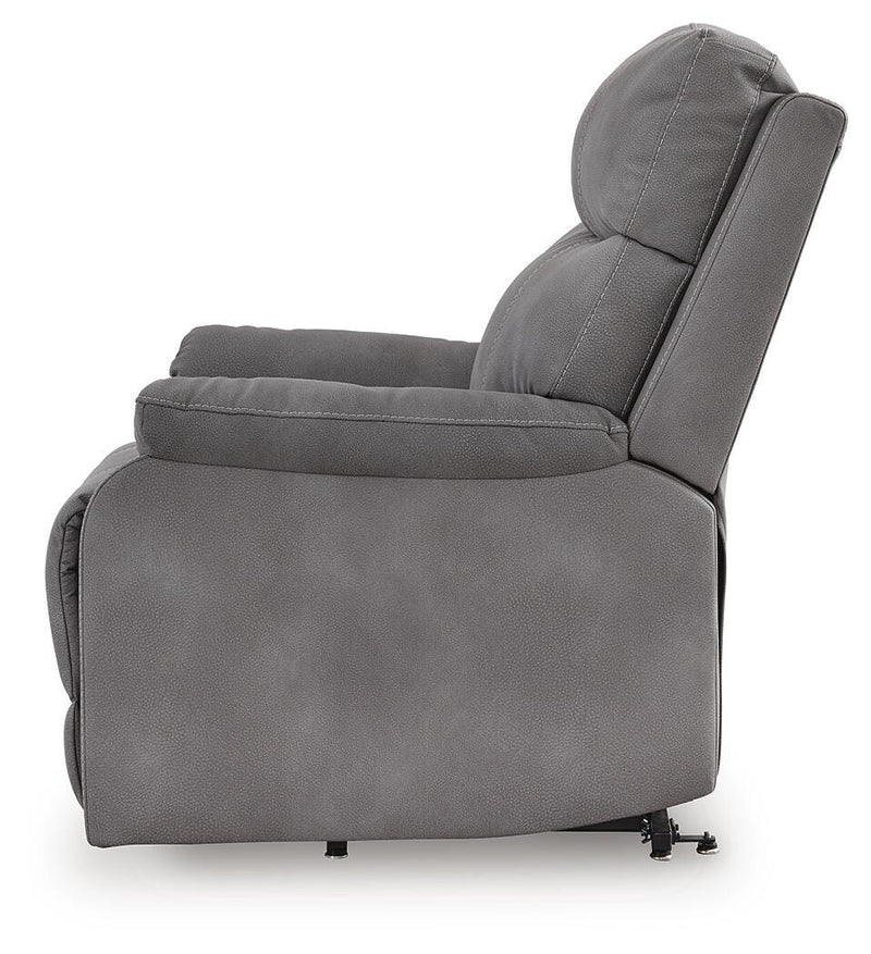 Ashley Furniture Next-Gen Durapella Power Lift Recliner with plush cushioning and a sturdy recline mechanism, shown from the side.