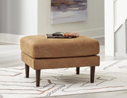 Ashley Furniture Telora living room set with sofa and armchair in neutral fabric, modern design, and plush cushions.