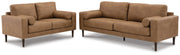 Ashley Furniture Telora living room set featuring a sofa, loveseat, and armchair with neutral upholstery and modern design.