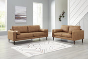 Ashley Furniture Telora living room set featuring a sofa and loveseat with plush cushions and modern design.