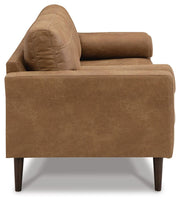 Ashley Furniture Telora living room set with plush sofa and matching armchair, featuring neutral upholstery and modern design.