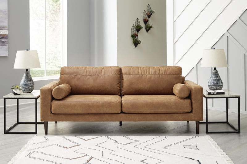 Ashley Furniture Telora living room set with sofa, loveseat, and coffee table arranged in a modern living space.