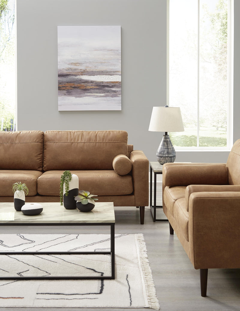 Ashley Furniture Telora living room set with sofa, loveseat, and armchair in a modern design, shown in a cozy living space.