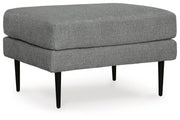 Ashley Furniture Hazela living room set with a sofa and armchair, featuring neutral fabric and contemporary design.