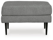 Ashley Furniture Hazela living room set with sofa and armchair in a modern design, featuring neutral upholstery and wooden legs.
