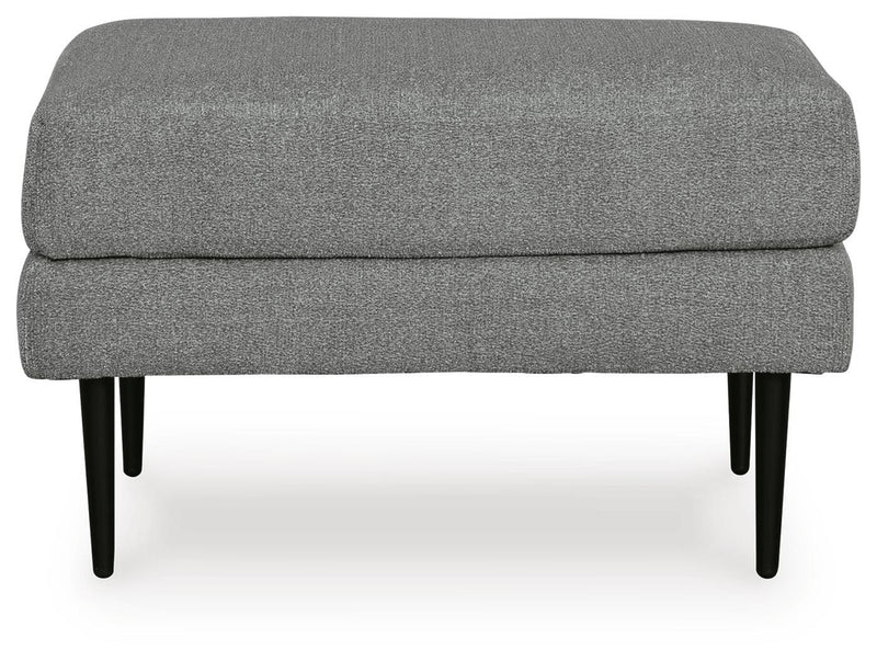 Ashley Furniture Hazela living room set with sofa and armchair in a modern design, featuring neutral upholstery and wooden legs.