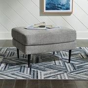 Ashley Furniture Hazela living room set with sofa, loveseat, and armchair in a modern design with neutral upholstery.
