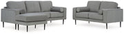Ashley Furniture Hazela living room set featuring a sofa and armchair with neutral fabric upholstery and contemporary design.
