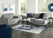 Ashley Furniture Hazela living room set with a sofa and armchair, featuring plush cushions and neutral upholstery.
