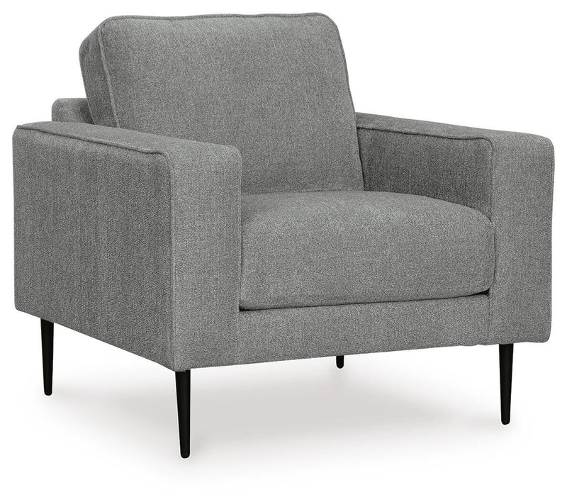Ashley Furniture Hazela living room set with sofa and loveseat, featuring neutral fabric upholstery and modern design.