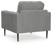Ashley Furniture Hazela living room set featuring a sofa and armchair with beige upholstery and wooden legs.