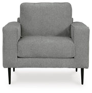 Ashley Furniture Hazela living room set with sofa and armchair, featuring plush cushions and modern design in neutral fabric.