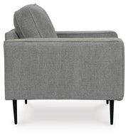 Ashley Furniture Hazela living room set with sofa and armchair, featuring neutral upholstery and modern design.