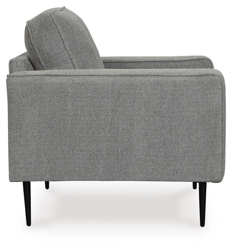 Ashley Furniture Hazela living room set with sofa and armchair, featuring neutral upholstery and modern design.
