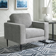Ashley Furniture Hazela living room set with sofa and armchair, featuring modern design and neutral fabric upholstery.
