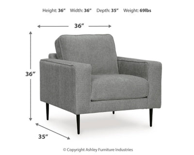 Ashley Furniture Hazela living room set with sofa and loveseat in neutral fabric, modern design, and plush cushions.