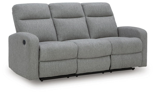 Ashley Furniture Gauntlet reclining sofa with plush fabric and padded arms, shown from an angled view.