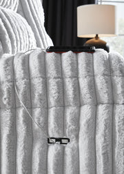 Ashley Furniture Rhines Falls power reclining loveseat with console, showing plush fabric, built-in USB ports, and reclining features.