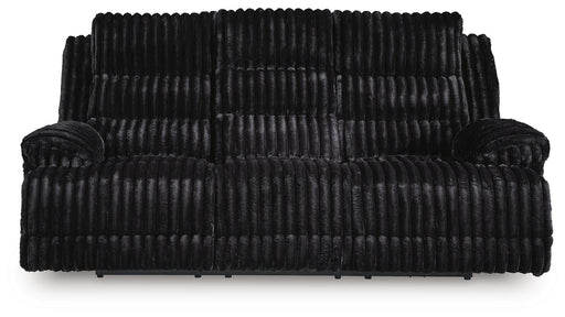 Ashley Furniture Rhine Falls power reclining sofa with drop-down table, featuring plush cushions and built-in cup holders.