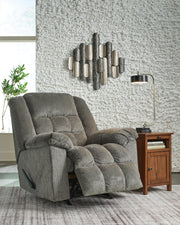 Open Ashley Furniture Kegler Recliner with plush upholstery and padded armrests, showcasing a comfortable living room seating option.