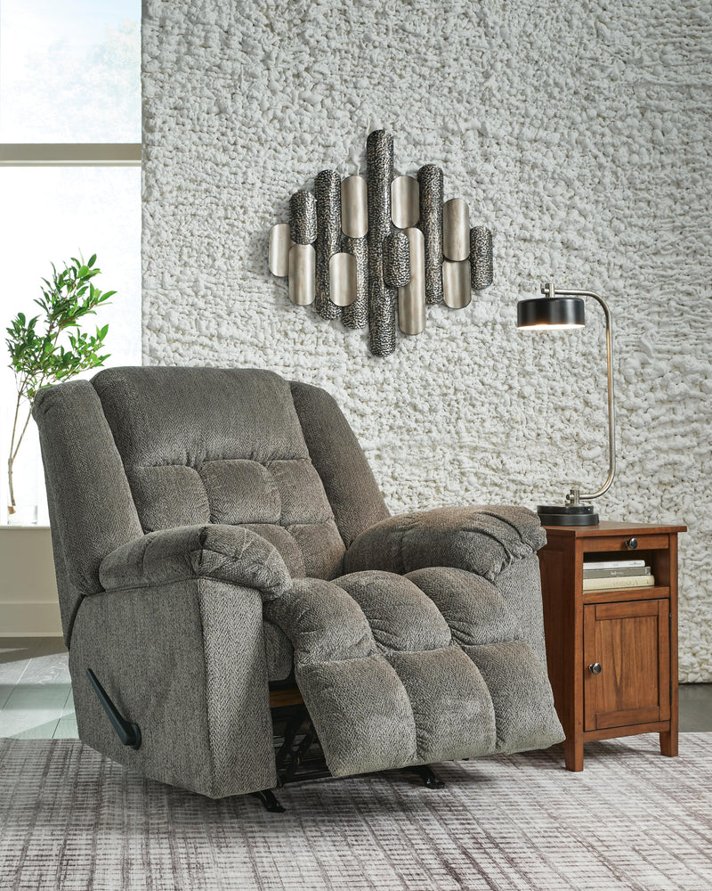 Open Ashley Furniture Kegler Recliner with plush upholstery and padded armrests, showcasing a comfortable living room seating option.