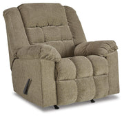 Ashley Furniture Kegler Recliner in dark brown fabric, shown from an angle with closed reclining mechanism and plush cushioning.