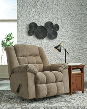 Ashley Furniture Kegler Recliner in plush fabric with padded armrests and a comfortable, modern design.