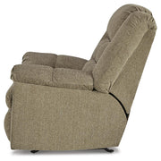 Ashley Furniture Kegler Recliner with plush cushions and wooden armrests, shown from the side in a cozy living room setting.