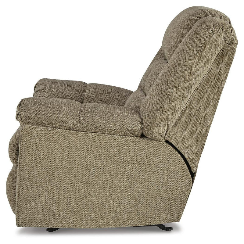 Ashley Furniture Kegler Recliner with plush cushions and wooden armrests, shown from the side in a cozy living room setting.