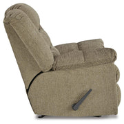 Ashley Furniture Kegler Recliner showing plush fabric upholstery and padded armrests in a cozy living room setting.