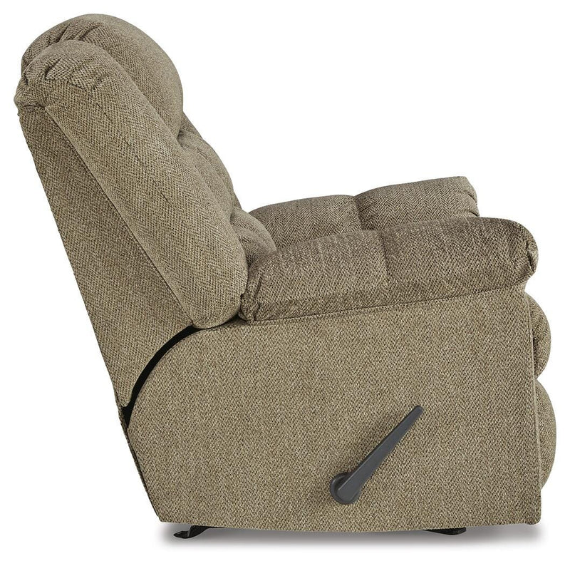 Ashley Furniture Kegler Recliner showing plush fabric upholstery and padded armrests in a cozy living room setting.