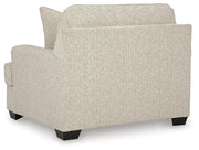 Ashley Furniture Heartcort Oversized Chair with plush upholstery and wide armrests, shown from the back with a modern design.