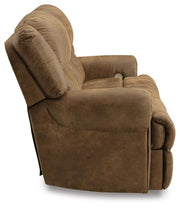 Ashley Furniture Boothbay power reclining sofa with plush cushions and reclining features, shown from the side in a modern living room setting.