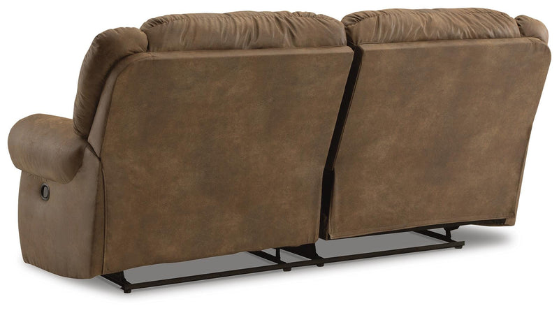 Ashley Furniture Boothbay Reclining Sofa with plush cushions and reclining features, shown from the back in a cozy living room setting.