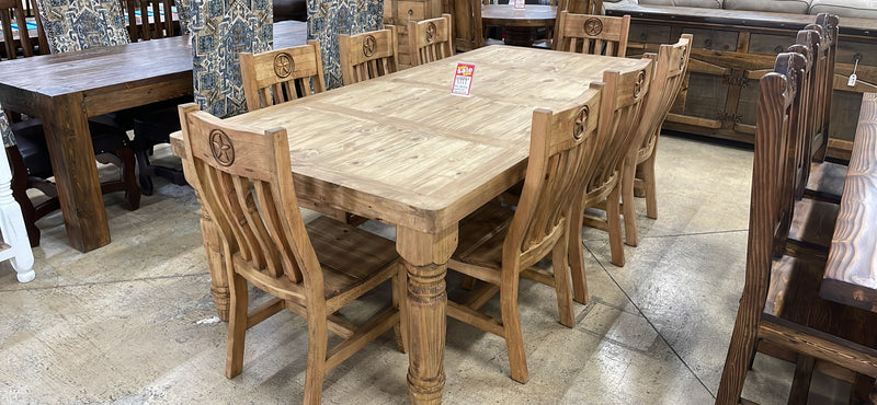 Sta. Rita 9-piece solid pine dining set with table and matching chairs by Monterrey Furniture, natural wood finish.
