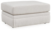 Ashley Furniture Maitelynn upholstery package featuring a living room sofa and loveseat in a stylish fabric, shown from an angled view.