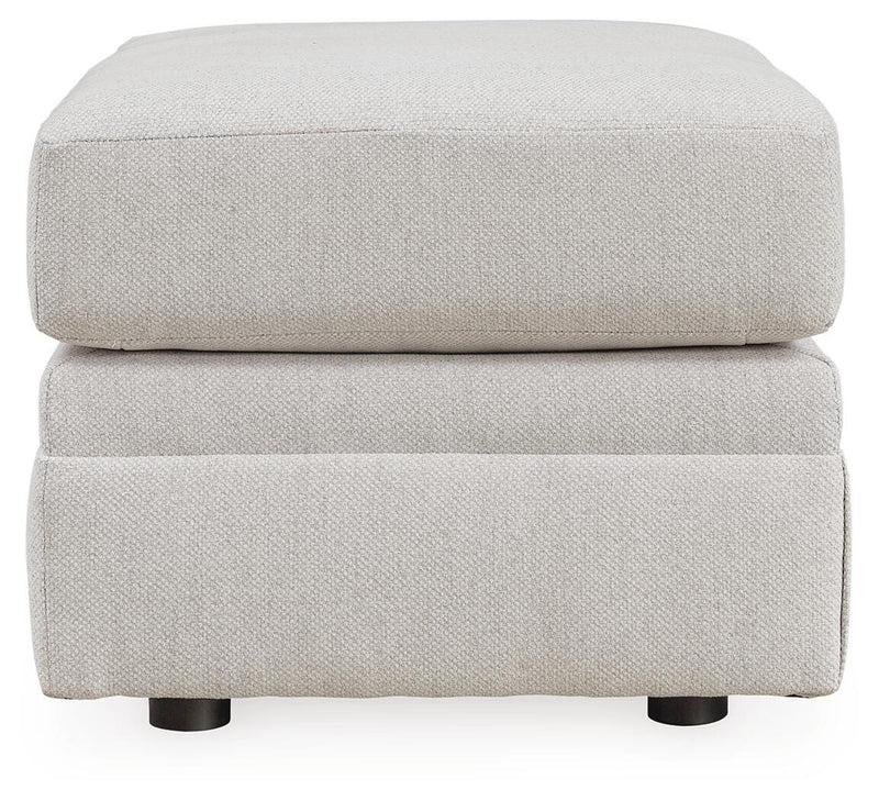 Ashley Furniture Maitelynn upholstery living room set with sectional sofa and matching cushions, beige fabric and modern design.