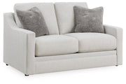 Ashley Furniture Maitelynn upholstery package, living room set featuring sofa and chair, shown from an angled side view.