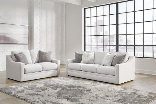Ashley Furniture Maitelynn upholstery living room set featuring a sofa and matching chairs in neutral fabric.