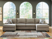 Ashley Furniture Newellen sectional with double chaise, showing plush fabric upholstery and modern design in a spacious living room setting.