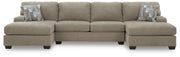 Ashley Furniture Newellen sectional with double chaise, featuring plush fabric and modern design in a spacious living room setting.