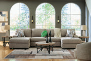 Ashley Furniture Newellen sectional with chaise, featuring plush upholstery and modern design, shown in a stylish living room setting.