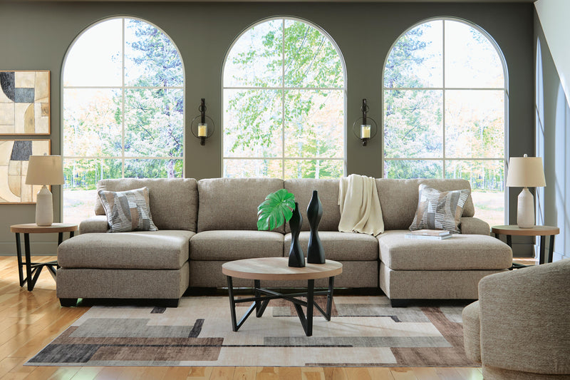 Ashley Furniture Newellen sectional with chaise, featuring plush upholstery and modern design, shown in a stylish living room setting.