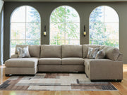 Ashley Furniture Newellen sectional with chaise, shown in a modern fabric, featuring plush cushions and a spacious seating arrangement.