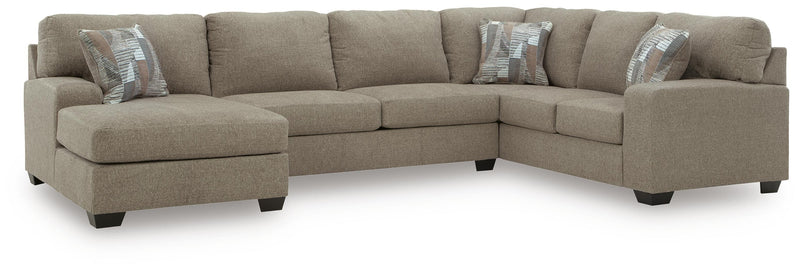 Ashley Furniture Newellen Sleeper Sectional with Chaise featuring plush fabric and modern design in a neutral color.