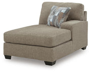 Ashley Furniture Newellen sectional with chaise in a modern fabric, showing the angled view of the L-shaped sofa.